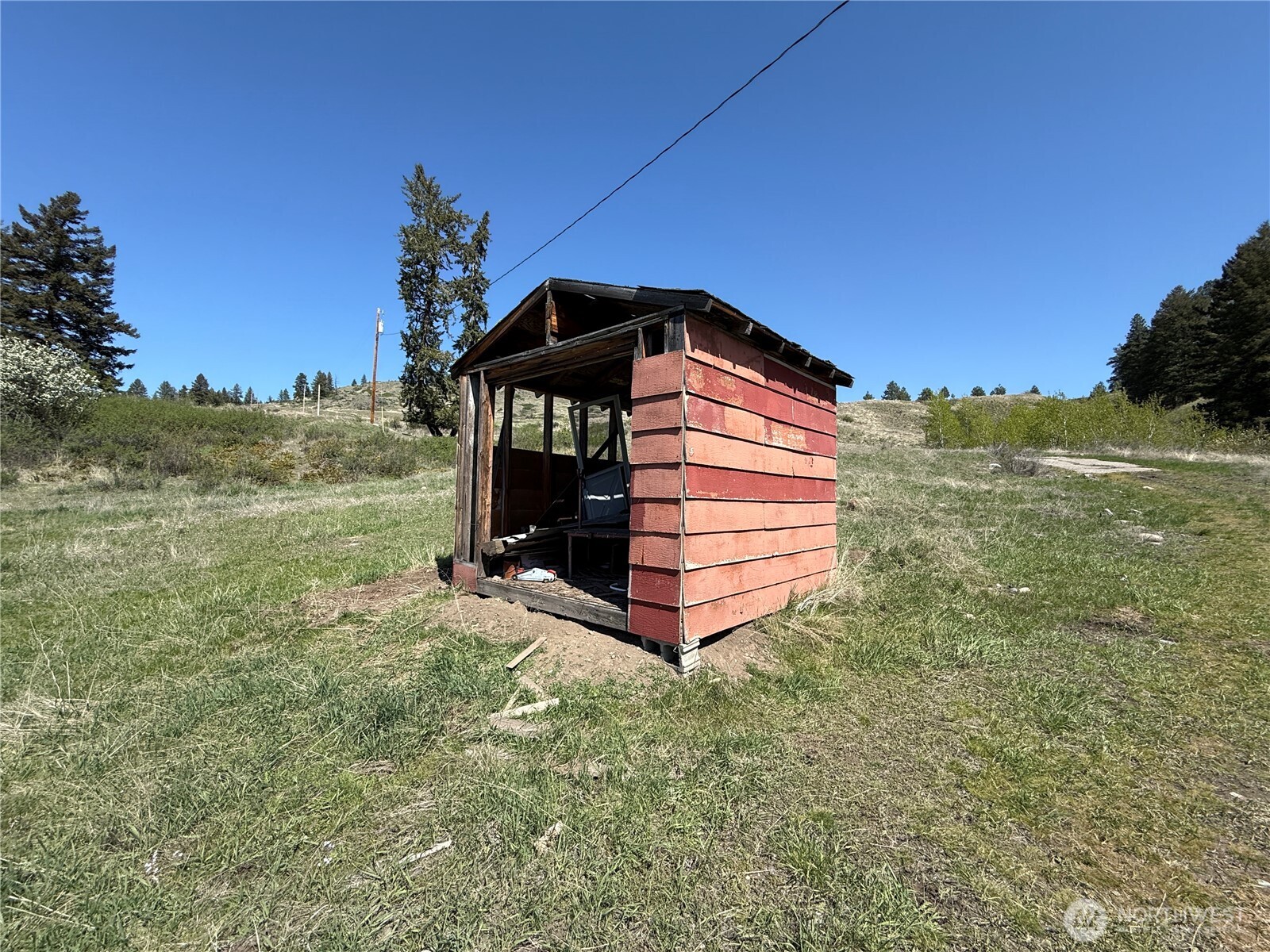 26 Grandview Road Curlew, WA 99118 - Photo 14 of 34 a front view of a house with a yard