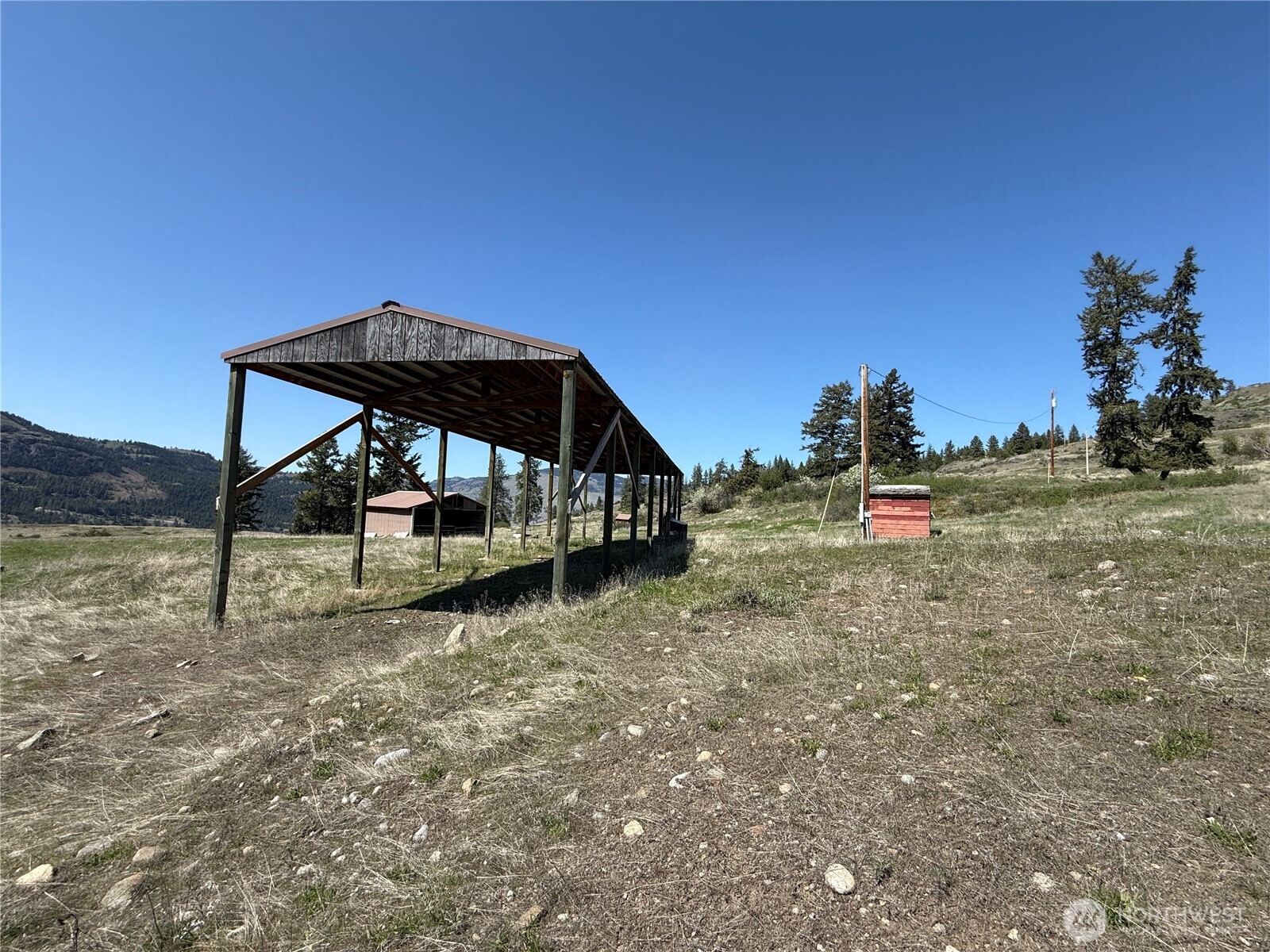 26 Grandview Road Curlew, WA 99118 - Photo 15 of 34 a view of a house with a yard and sitting area