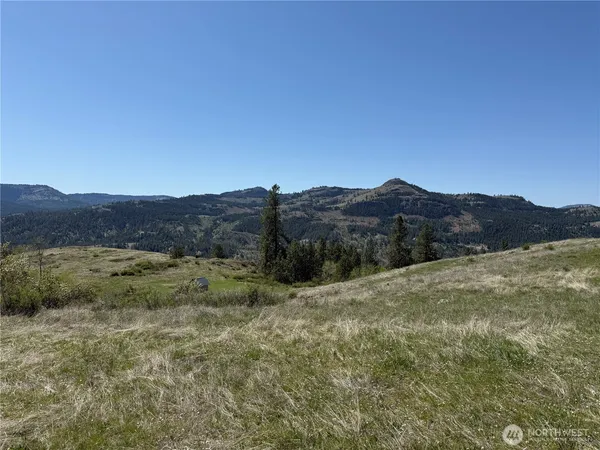 a view of an outdoor space and mountains