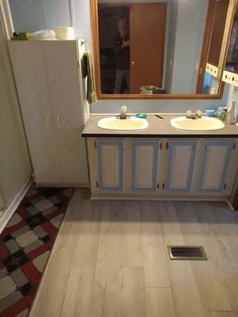 a bathroom with a sink and a mirror
