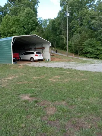 a car parked in the middle of a field
