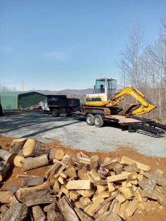 a view of a yard with wooden fence