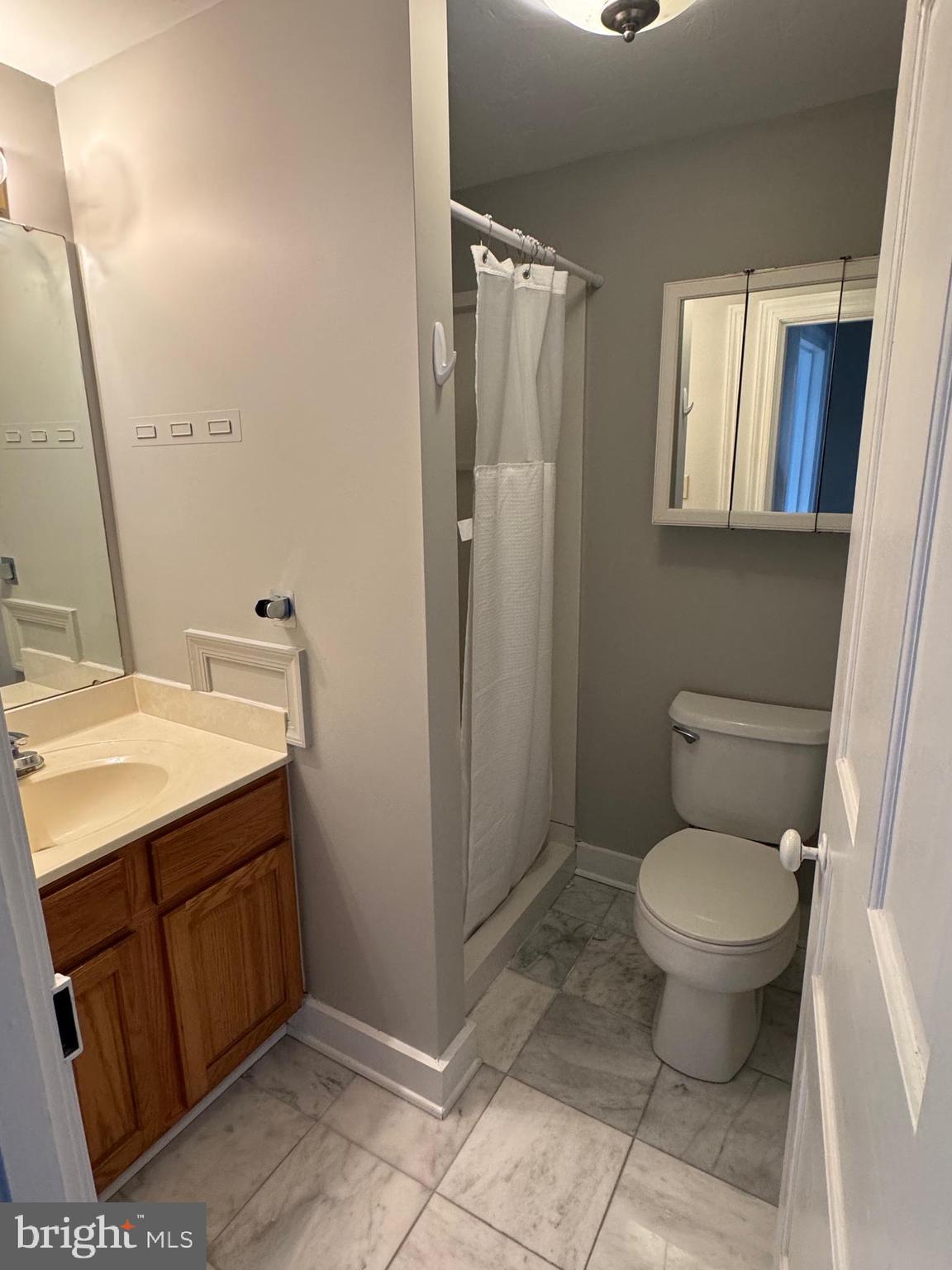 302 North Stratton Street Gettysburg, PA 17325 - Photo 13 of 15 a bathroom with a granite countertop toilet and a sink