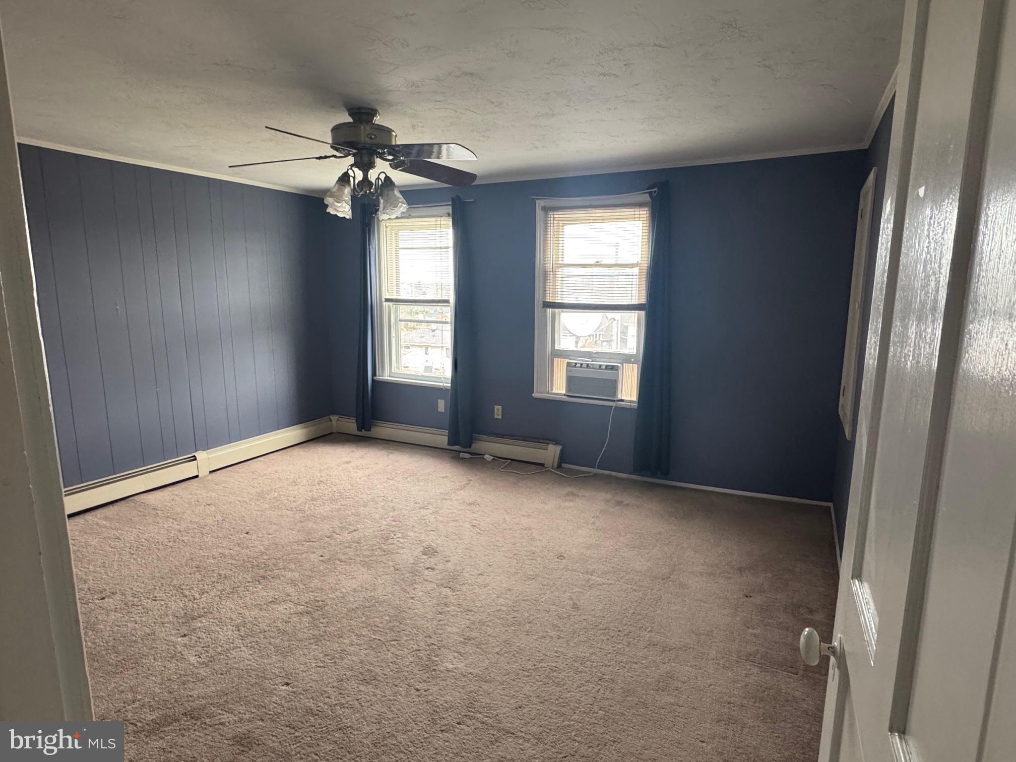 302 North Stratton Street Gettysburg, PA 17325 - Photo 14 of 15 an empty room with windows and chandelier fan