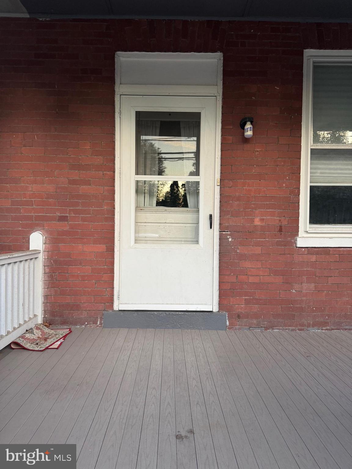 302 North Stratton Street Gettysburg, PA 17325 - Photo 3 of 15 a view of a hallway with wooden floor and a living room