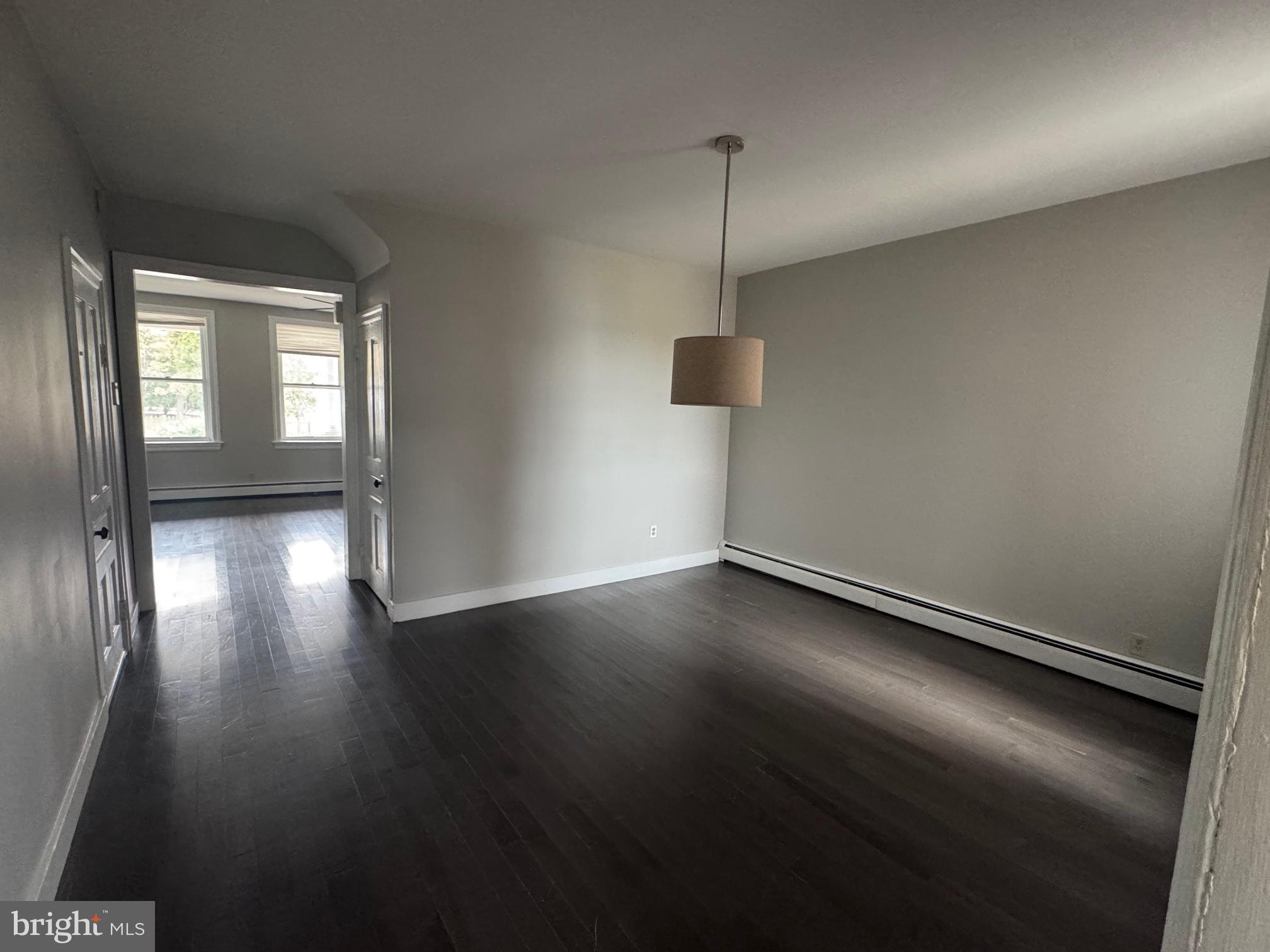 302 North Stratton Street Gettysburg, PA 17325 - Photo 5 of 15 a view of an empty room with wooden floor and a window