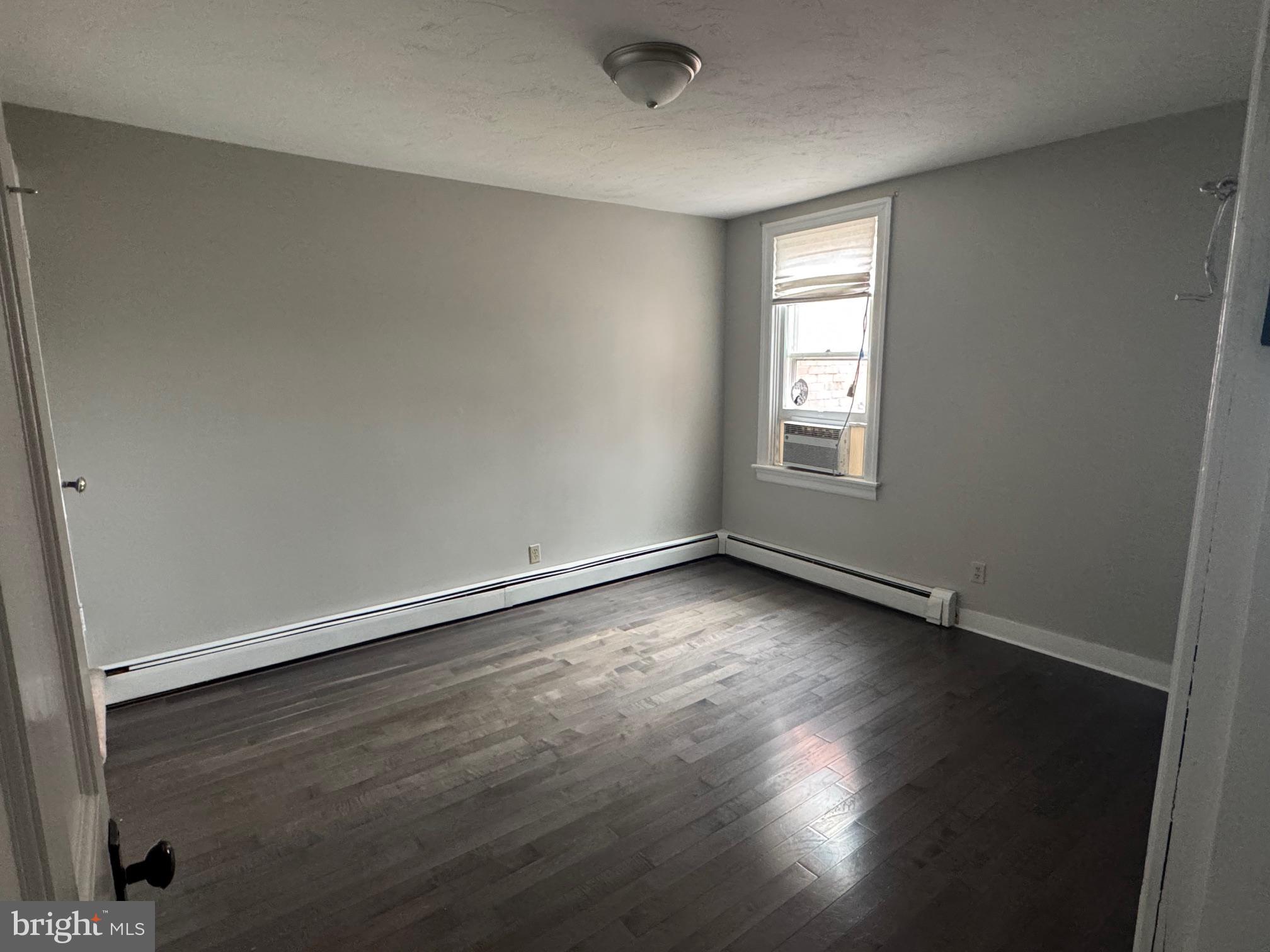 302 North Stratton Street Gettysburg, PA 17325 - Photo 9 of 15 an empty room with wooden floor and windows