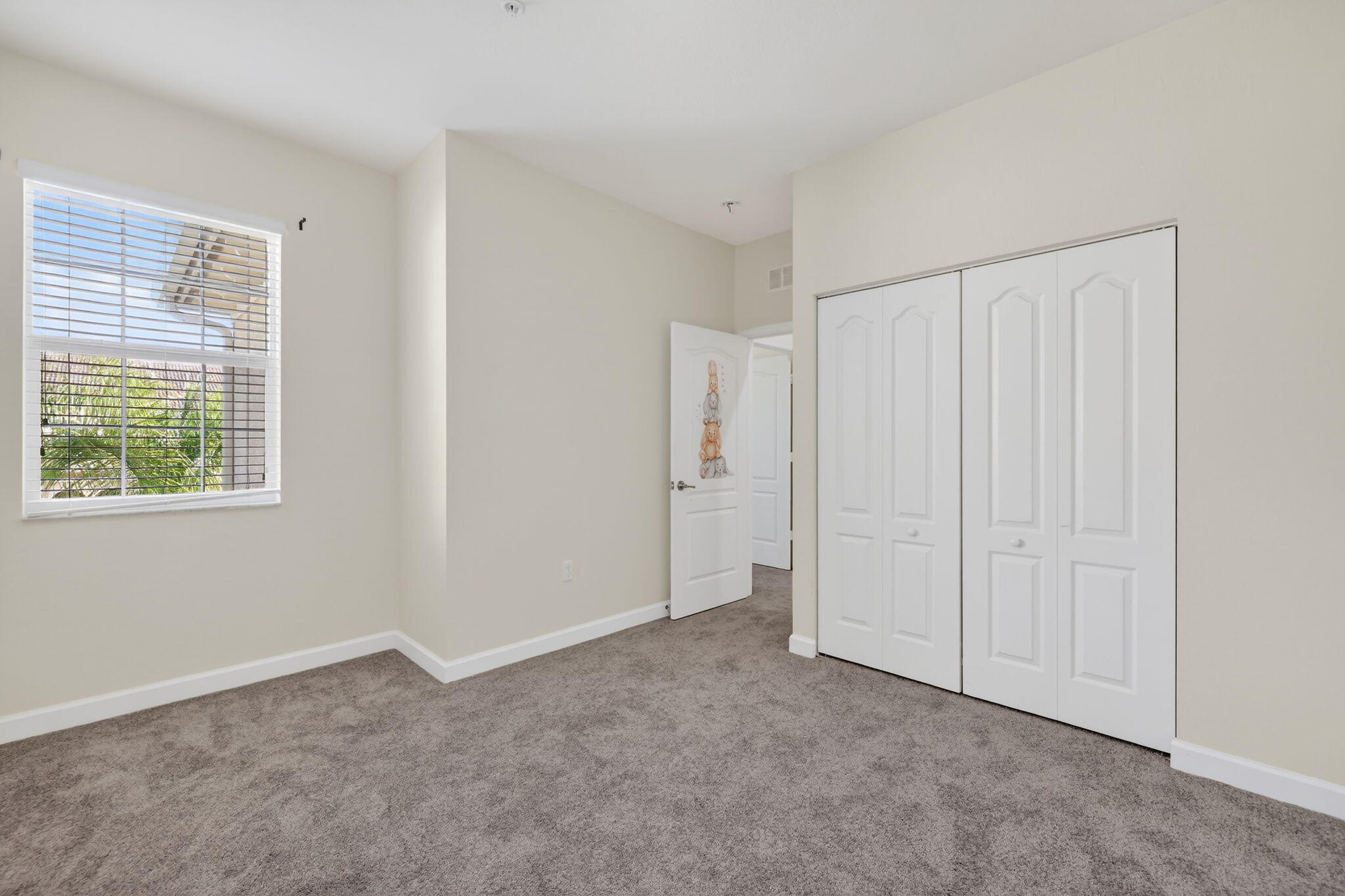 9504 Southwest Otter Lane Stuart, FL 34997 - Photo 25 of 36 a view of an empty room with a window