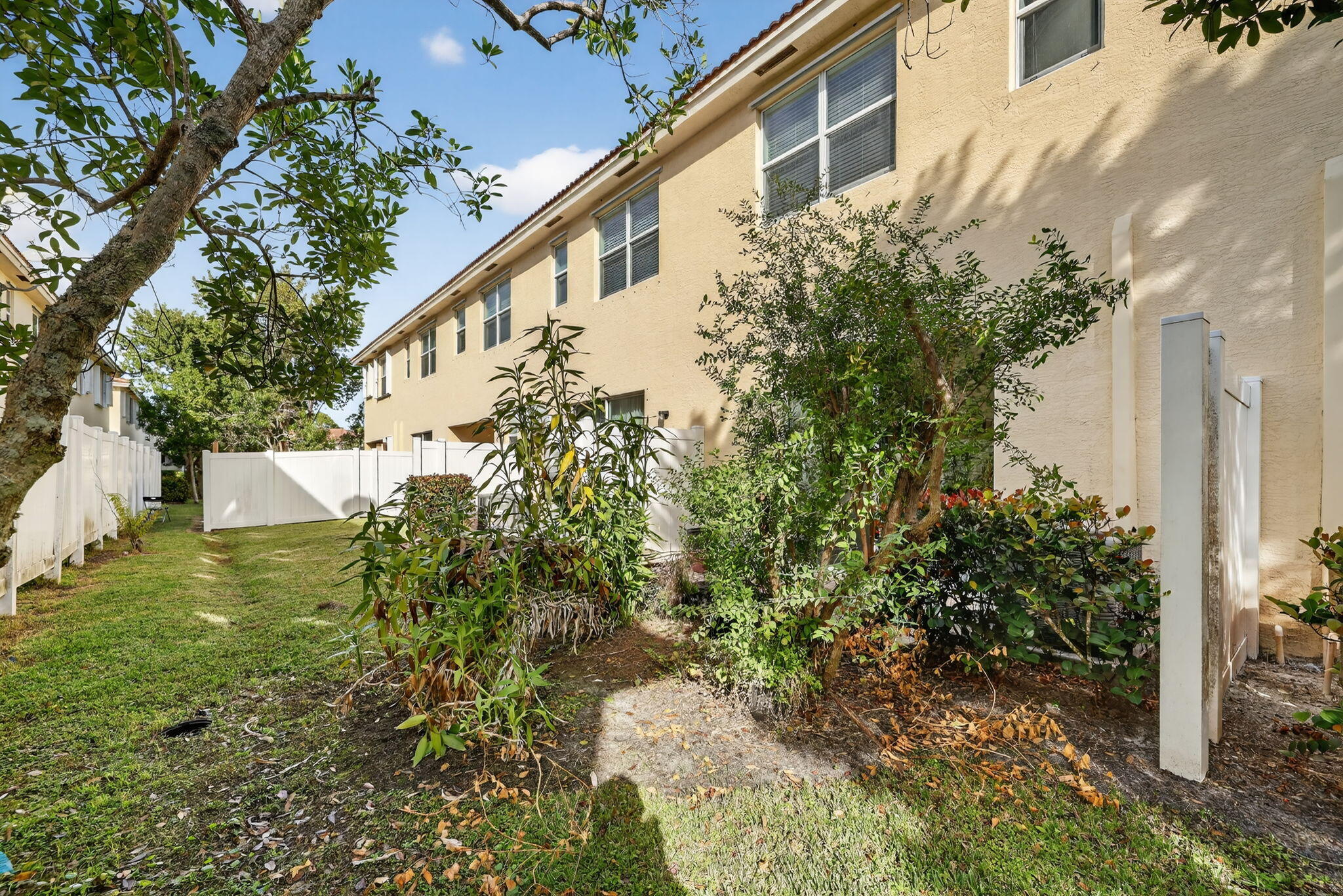 9504 Southwest Otter Lane Stuart, FL 34997 - Photo 32 of 36 a view of a house with a yard
