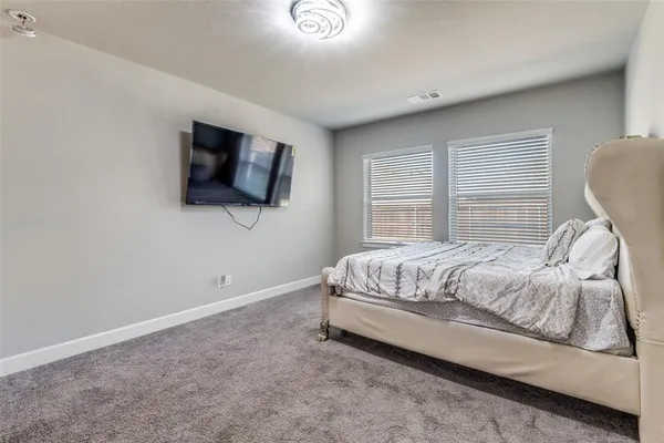 a living room with furniture windows and wooden floor