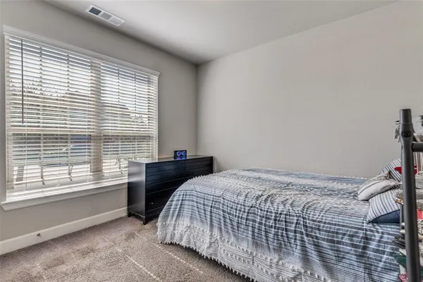 a spacious bathroom with a double vanity sink a mirror and a bathtub