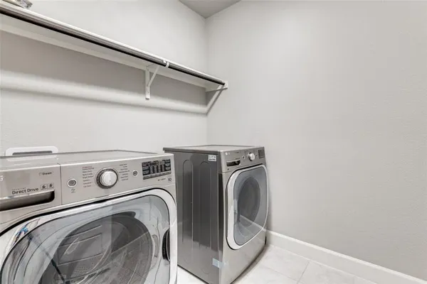 a bathroom with a sink toilet and a mirror