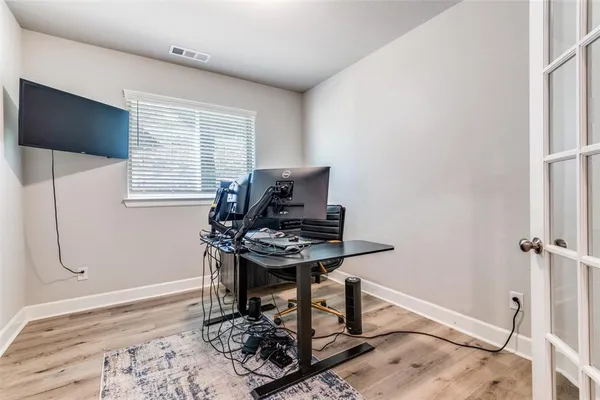 a view of an entryway with wooden floor