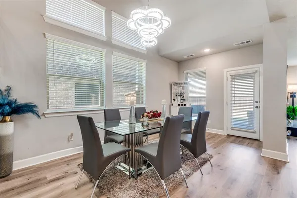 a kitchen with granite countertop a sink stove and cabinets