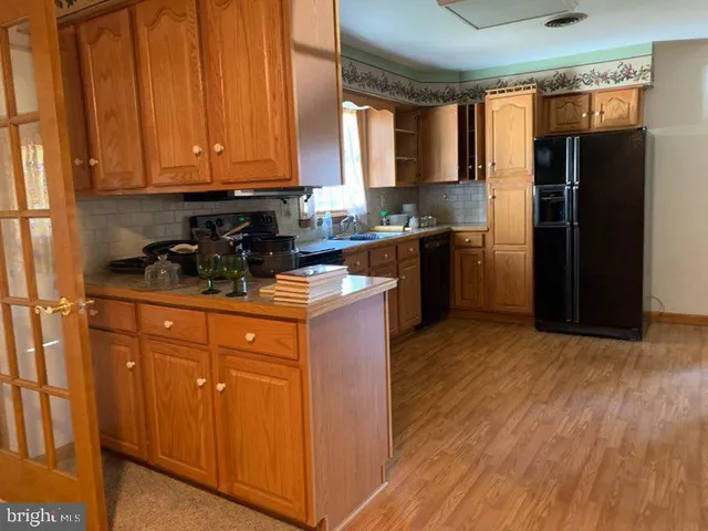 a view of empty room with wooden walls