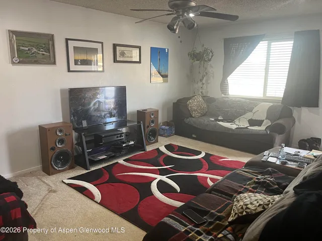 a bedroom with a bed and a lamp