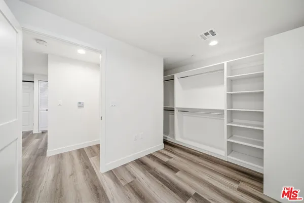 a view of an empty walk in closet