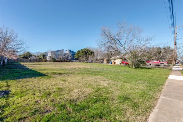a view of a park with large trees