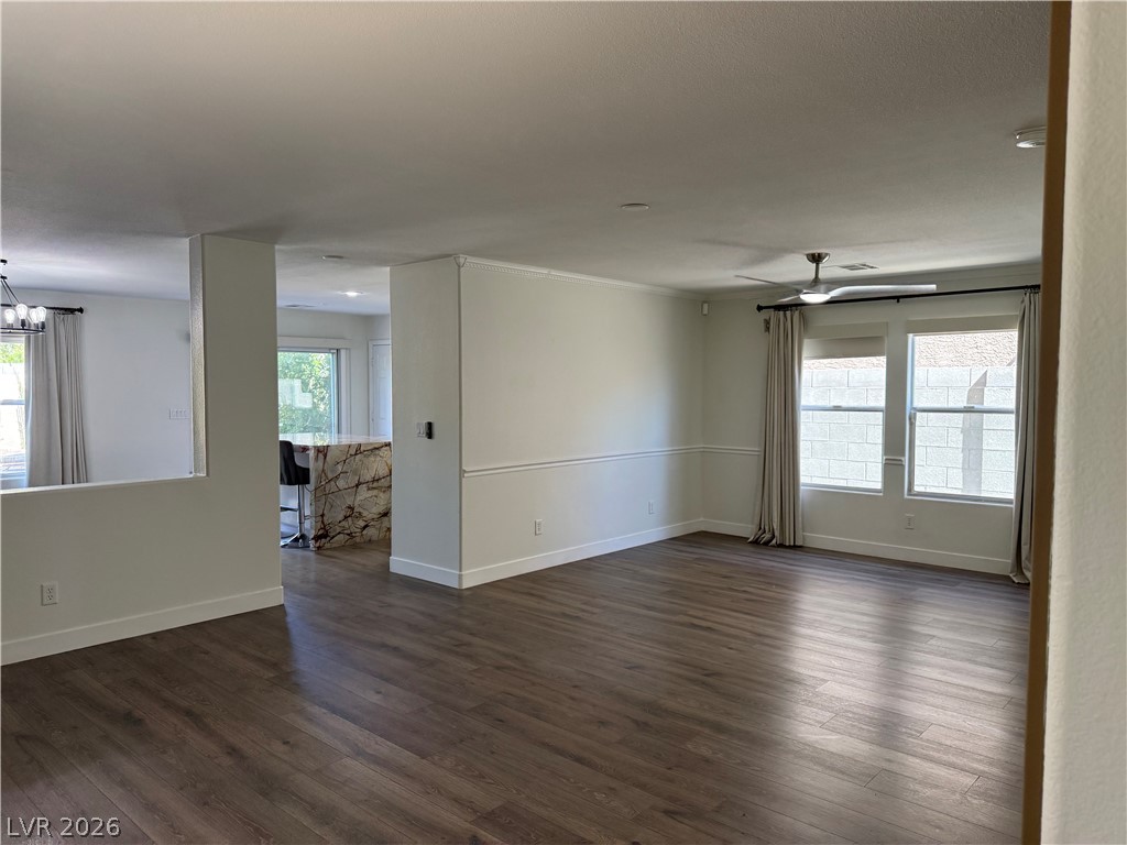 1141 Cathedral Ridge Street Henderson, NV 89052 - Photo 35 of 77 This bright, open-concept interior features wood flooring and ample natural light, perfect for comfortable living.