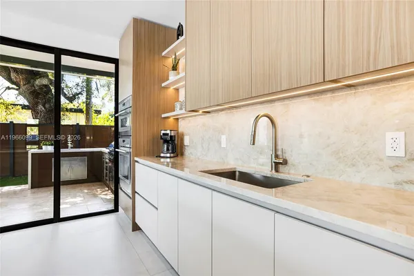 a view of a bathroom with a shower and a sink