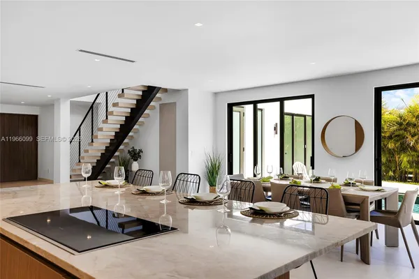 a bedroom with two beds and painting on the wall