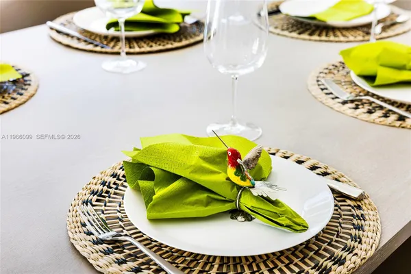 a bedroom with a large bed and a large window