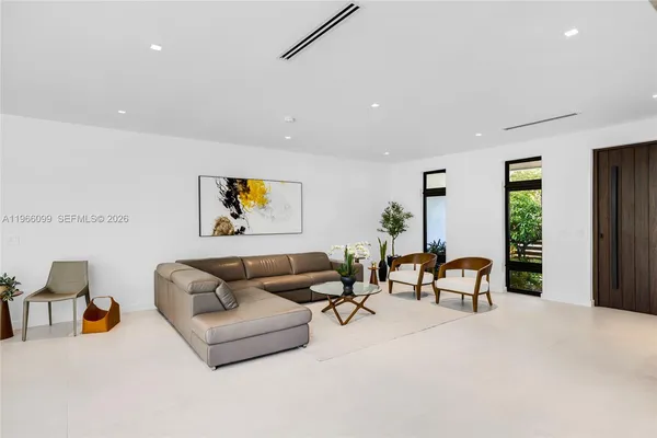 a living room with furniture and a window