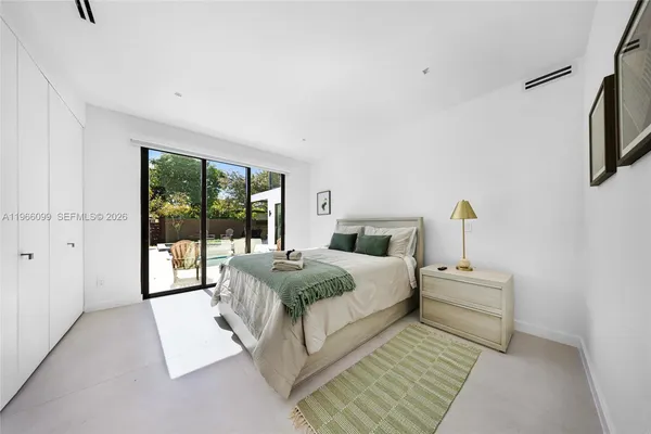 a bathroom with a white bath tub and a shower