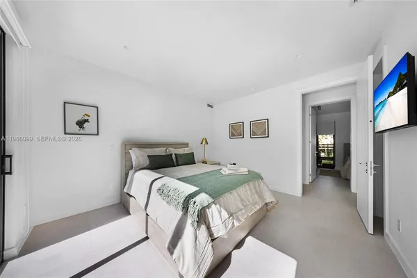 a view of a house with backyard porch and sitting area