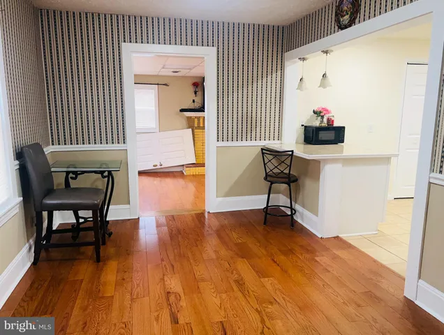 a room with furniture and wooden floor