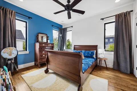 a bed room with a bed and a chandelier