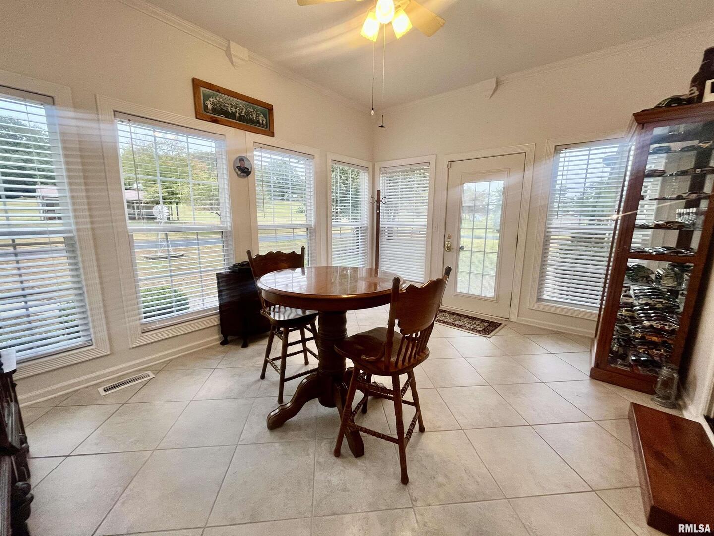 3220 Massac Creek Road Metropolis, IL 62960 - Photo 19 of 76 a view of a dining room with furniture and a window