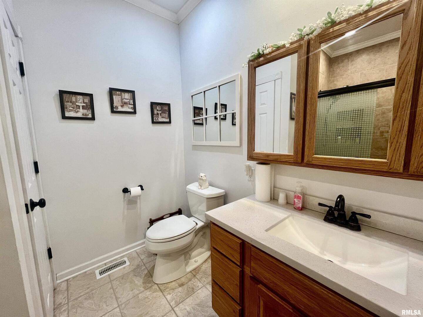 3220 Massac Creek Road Metropolis, IL 62960 - Photo 24 of 76 a bathroom with a granite countertop sink toilet and a shower