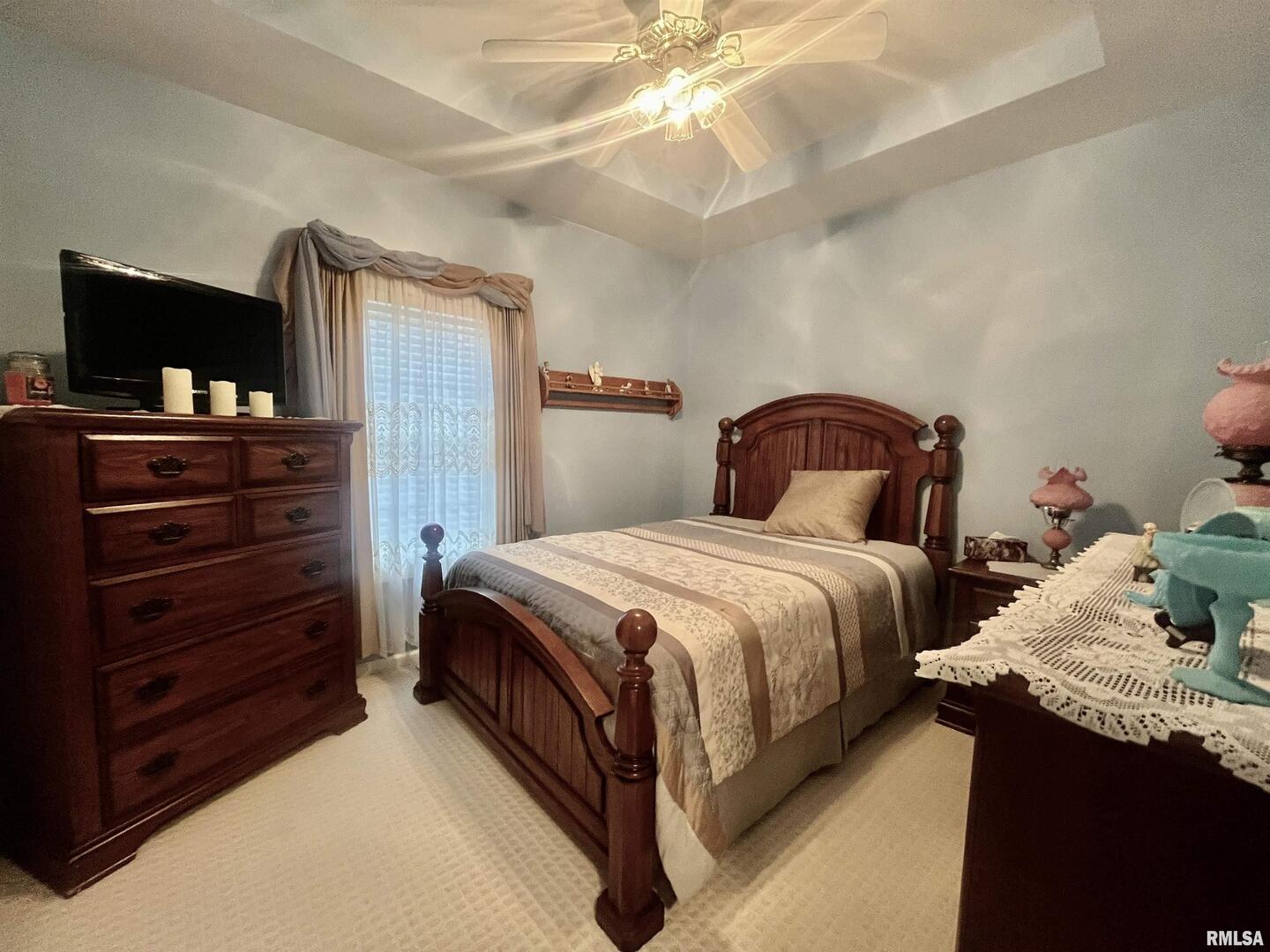 3220 Massac Creek Road Metropolis, IL 62960 - Photo 28 of 76 a bedroom with a bed and flat screen tv