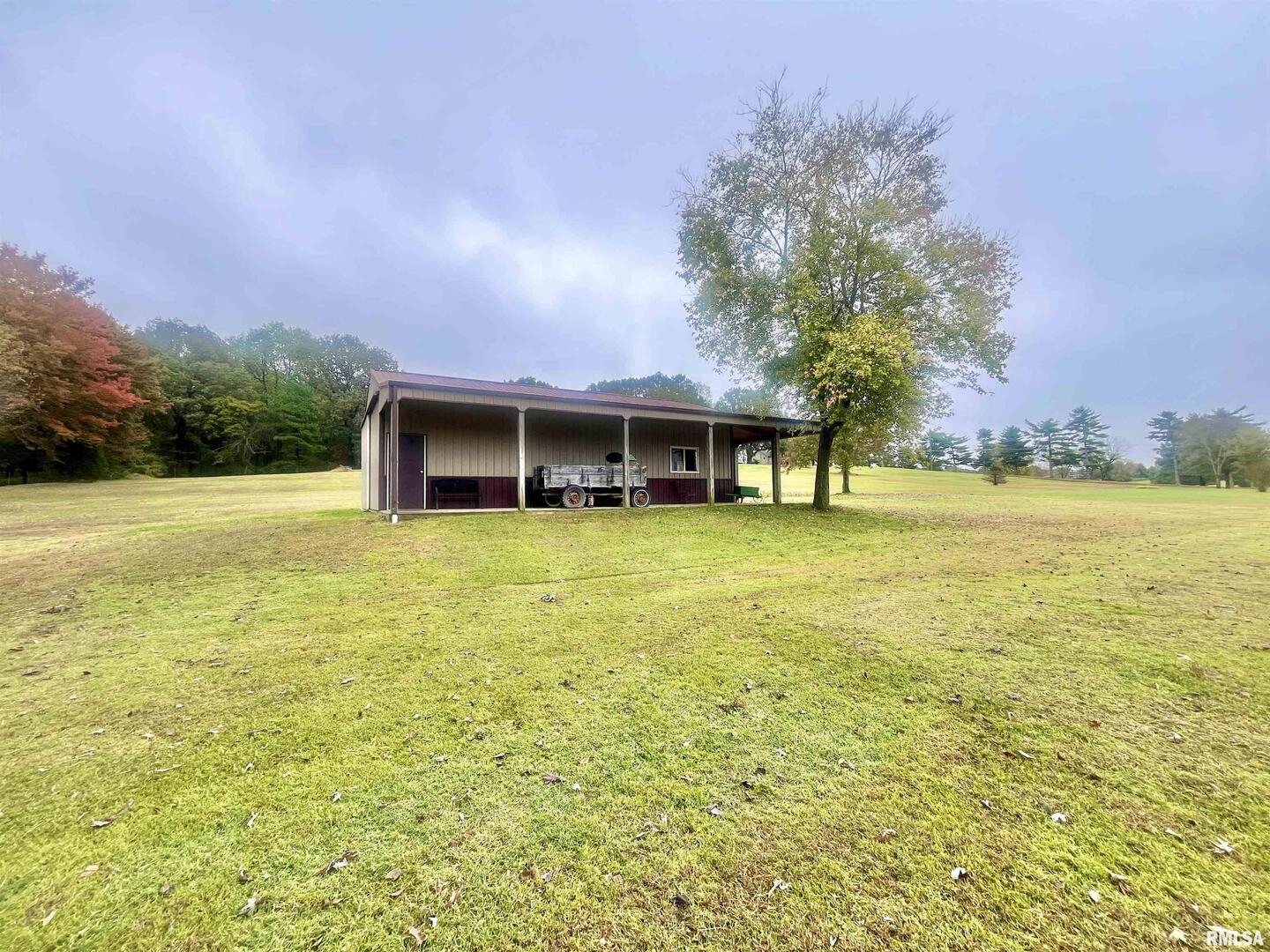 3220 Massac Creek Road Metropolis, IL 62960 - Photo 46 of 76 a view of a lake with a house in the background