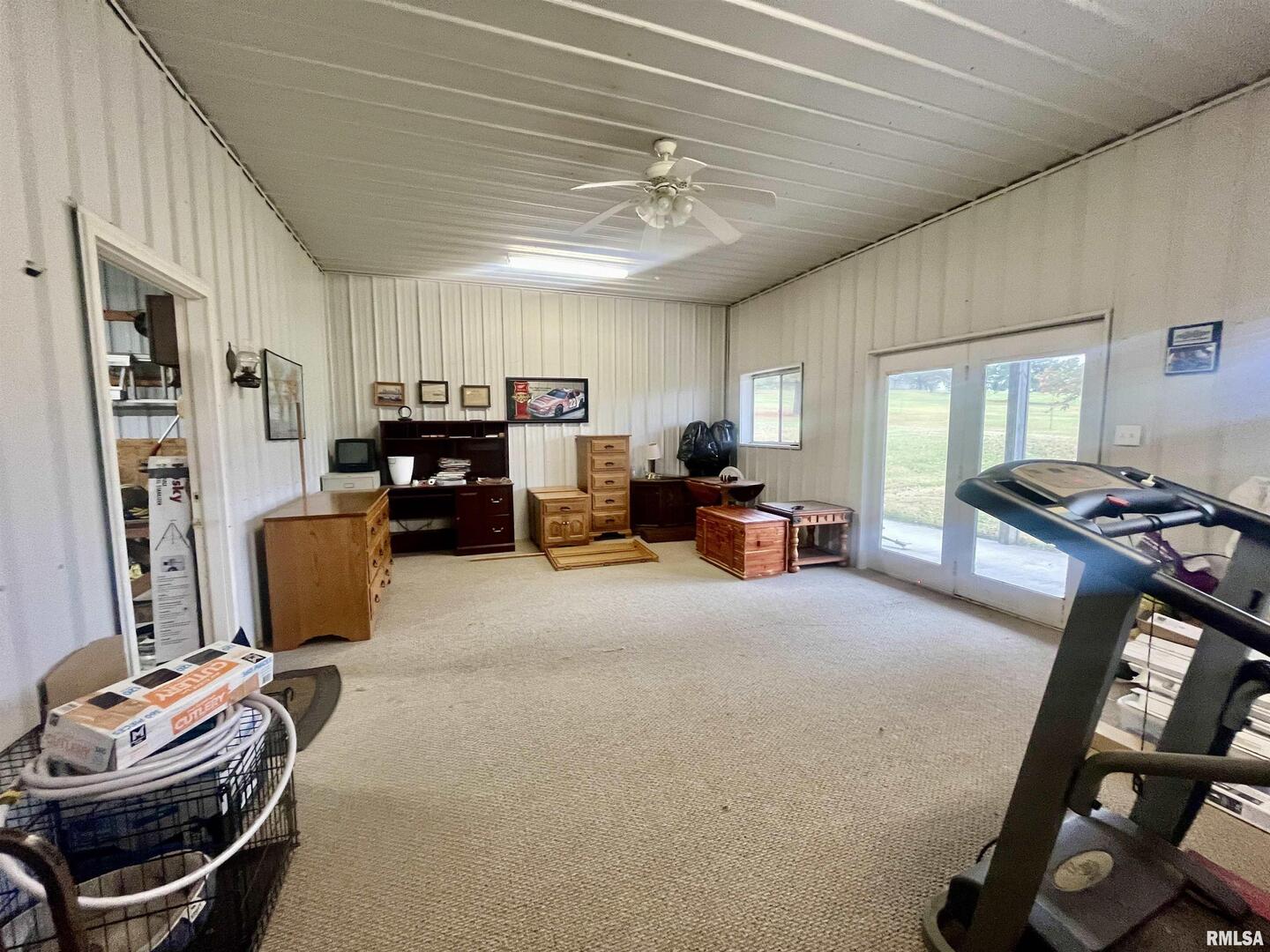 3220 Massac Creek Road Metropolis, IL 62960 - Photo 50 of 76 a room with furniture a flat screen tv and a window