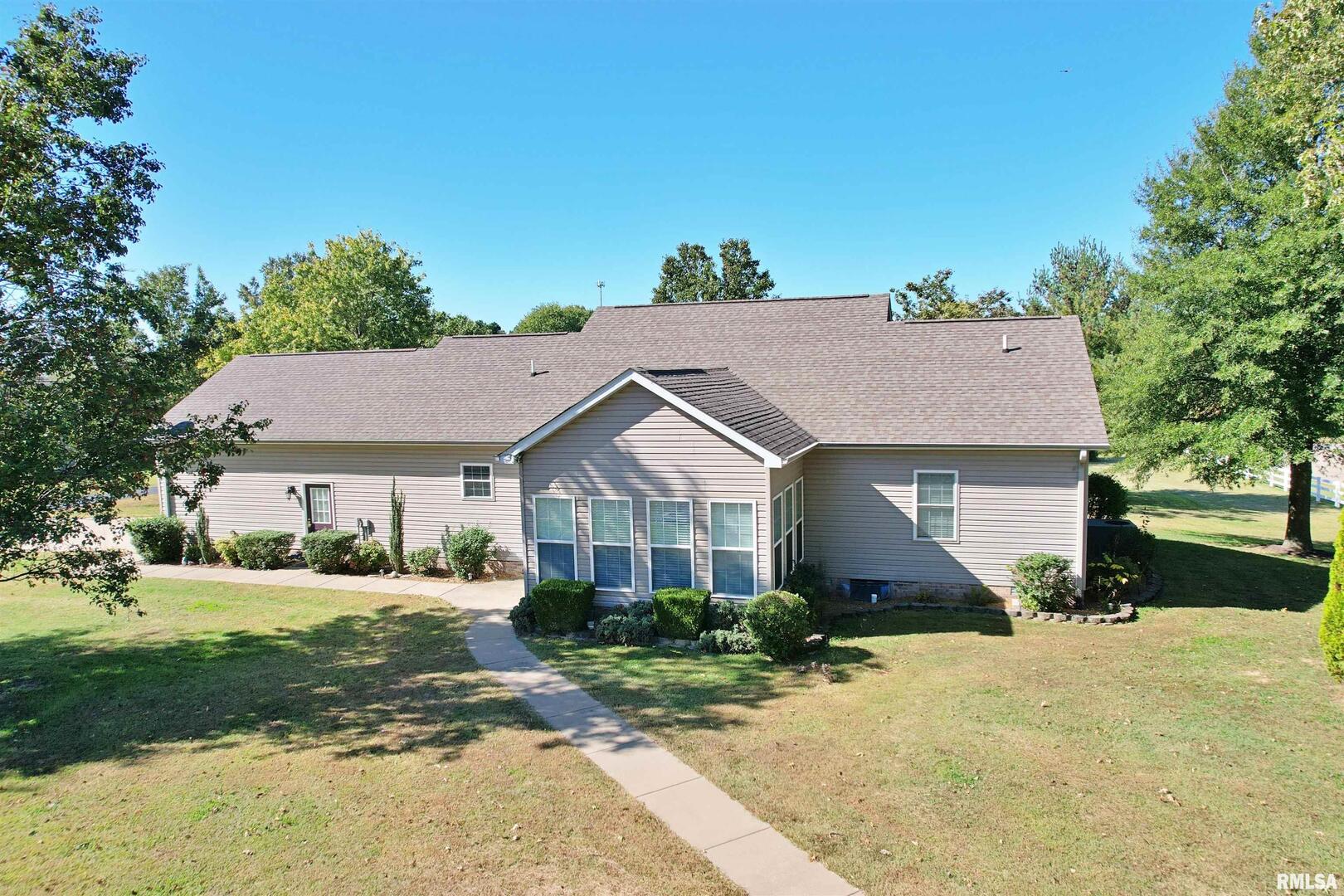 3220 Massac Creek Road Metropolis, IL 62960 - Photo 58 of 76 a front view of a house with a yard and trees