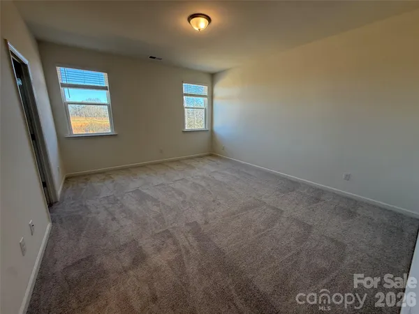 a bathroom with a sink vanity granite and a mirror