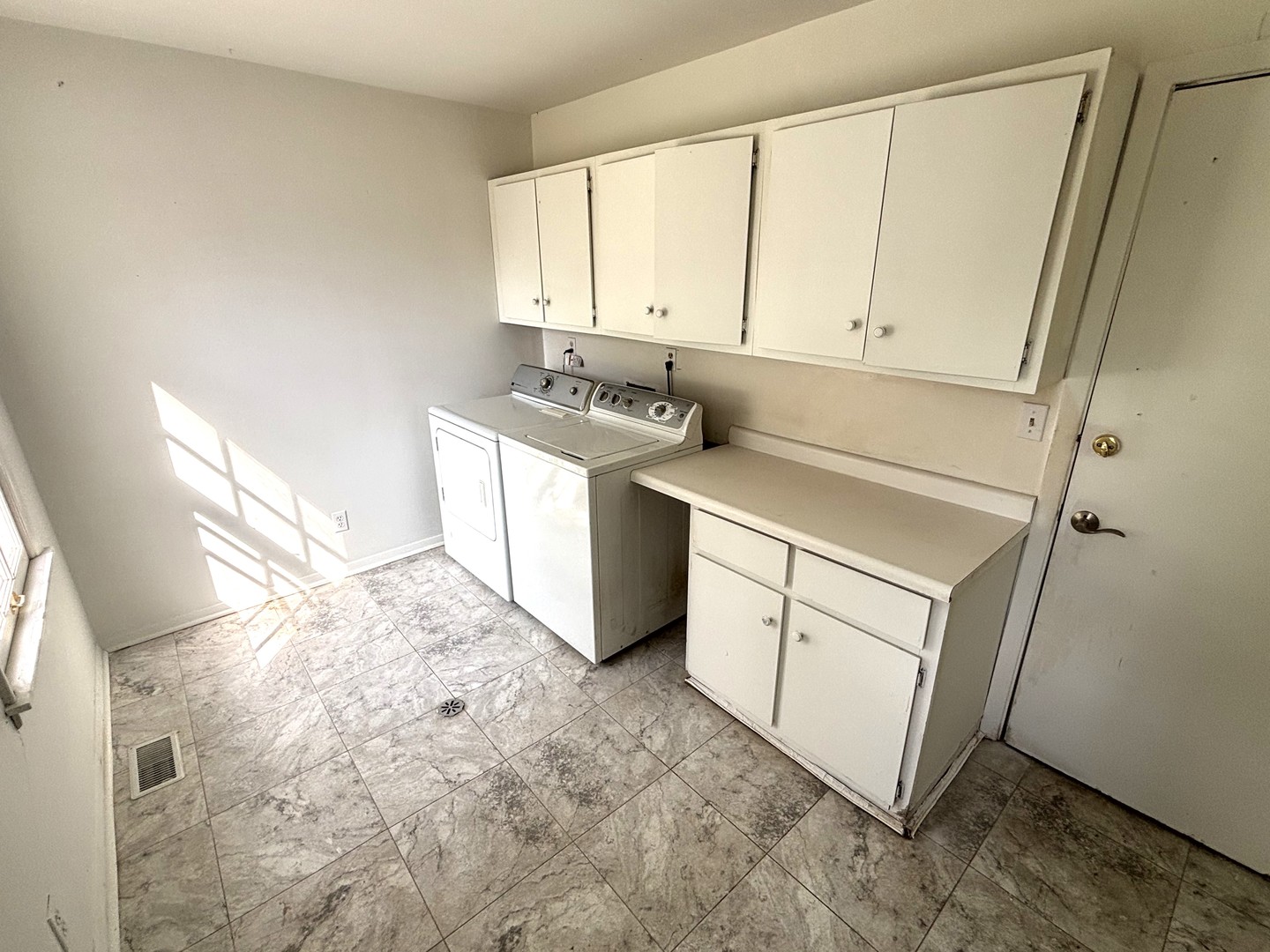 22 Guilford Road Montgomery, IL 60538 - Photo 12 of 14 a utility room with cabinets washer and dryer