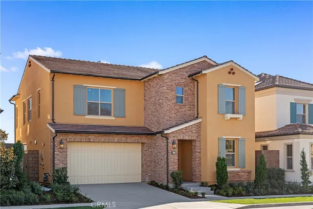 a front view of a house with a garage