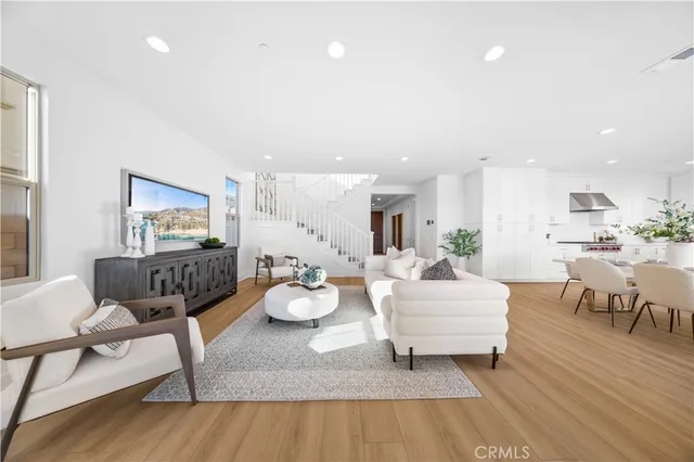 a bedroom with a bed and painting on the wall