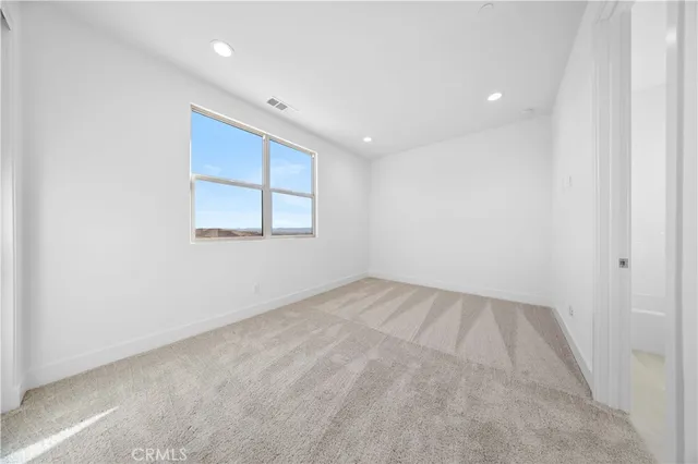 a bed room with two bed and a chandelier