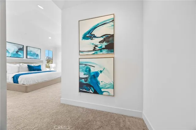 a spacious bathroom with a double vanity sink mirror and bathtub