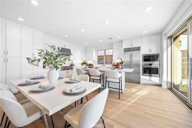 a kitchen with a table and chairs in it