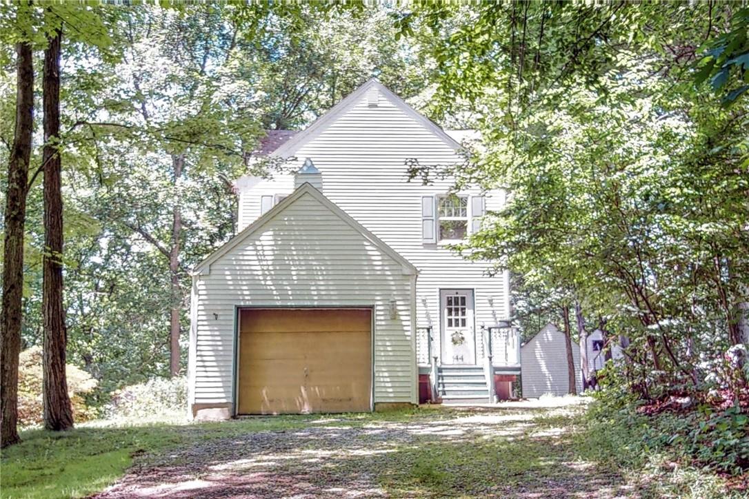 144 Alexander Road Monroe, NY 10950 - Photo 1 of 1 a front view of a house with a yard and garage