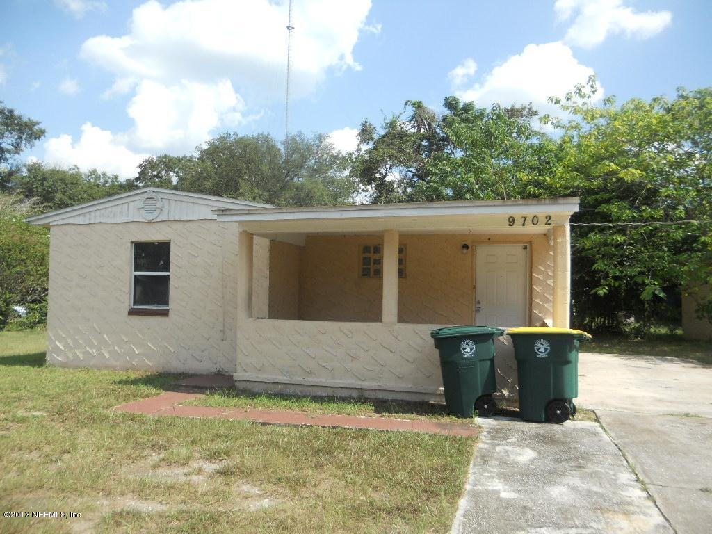 9702 Banks Road Jacksonville, FL 32246 - Photo 1 of 8 a view of a house with backyard and sitting area