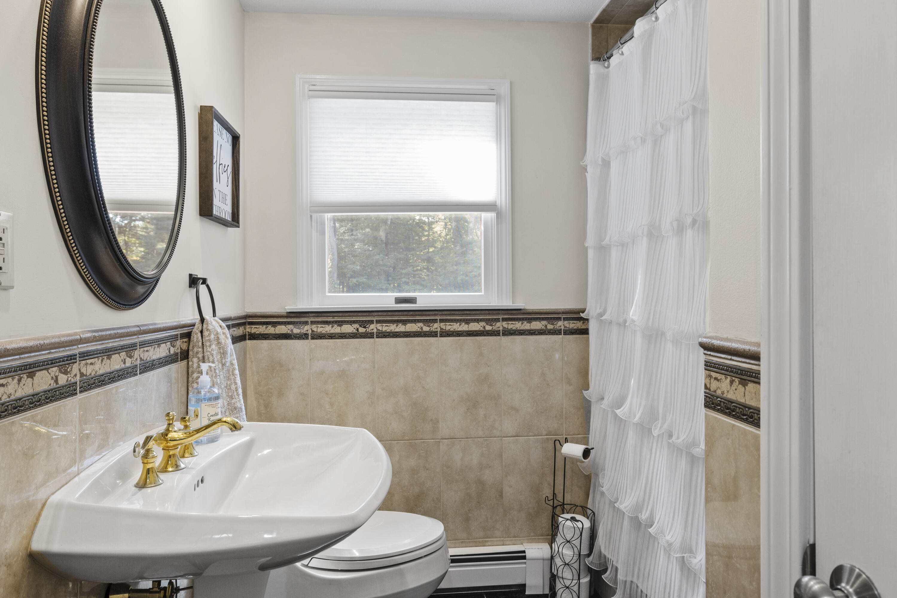 750 Old Barnstable Road Mashpee, MA 02649 - Photo 11 of 30 a bathroom with a sink toilet and a mirror