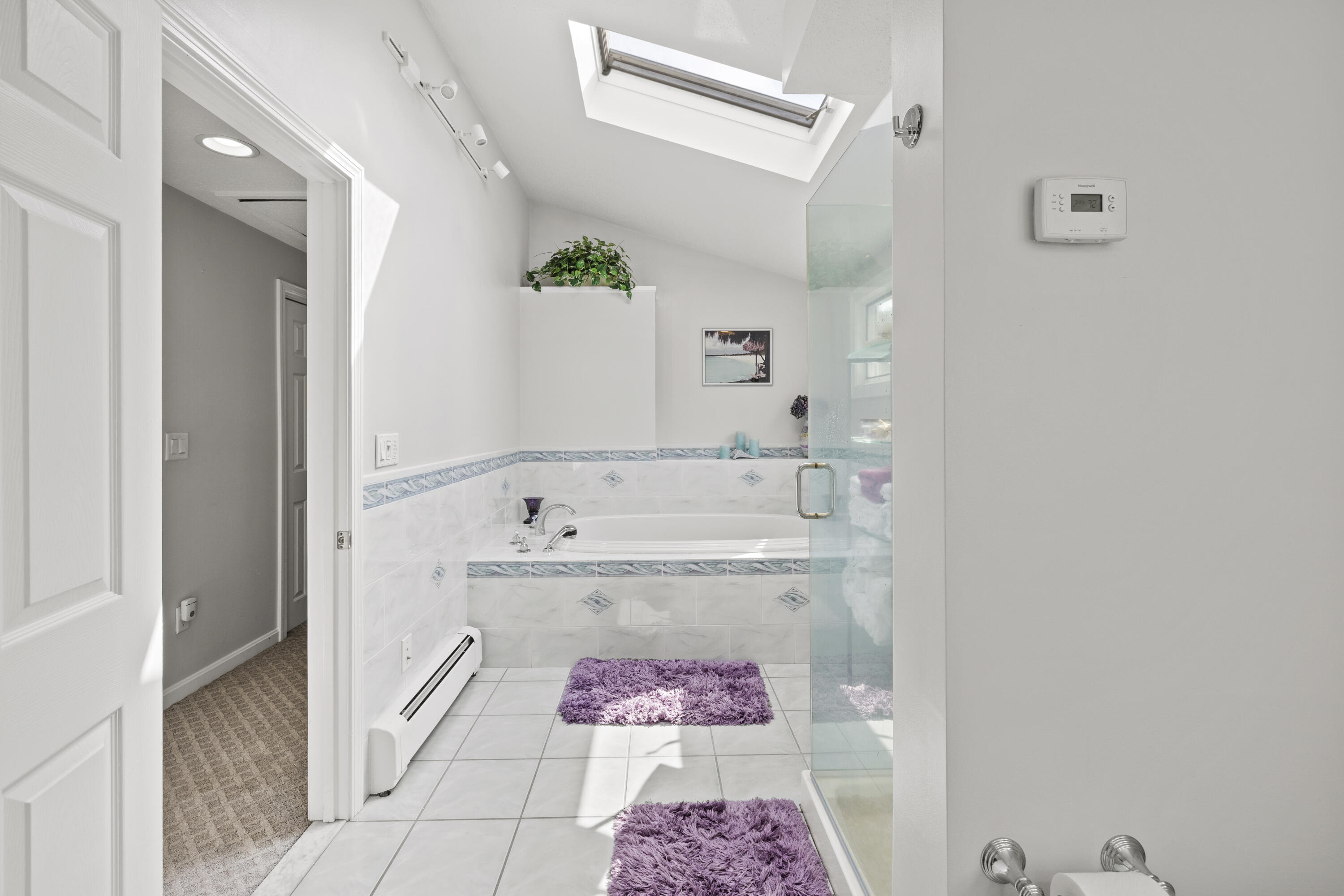 750 Old Barnstable Road Mashpee, MA 02649 - Photo 13 of 30 a bathroom with a tub shower and sink