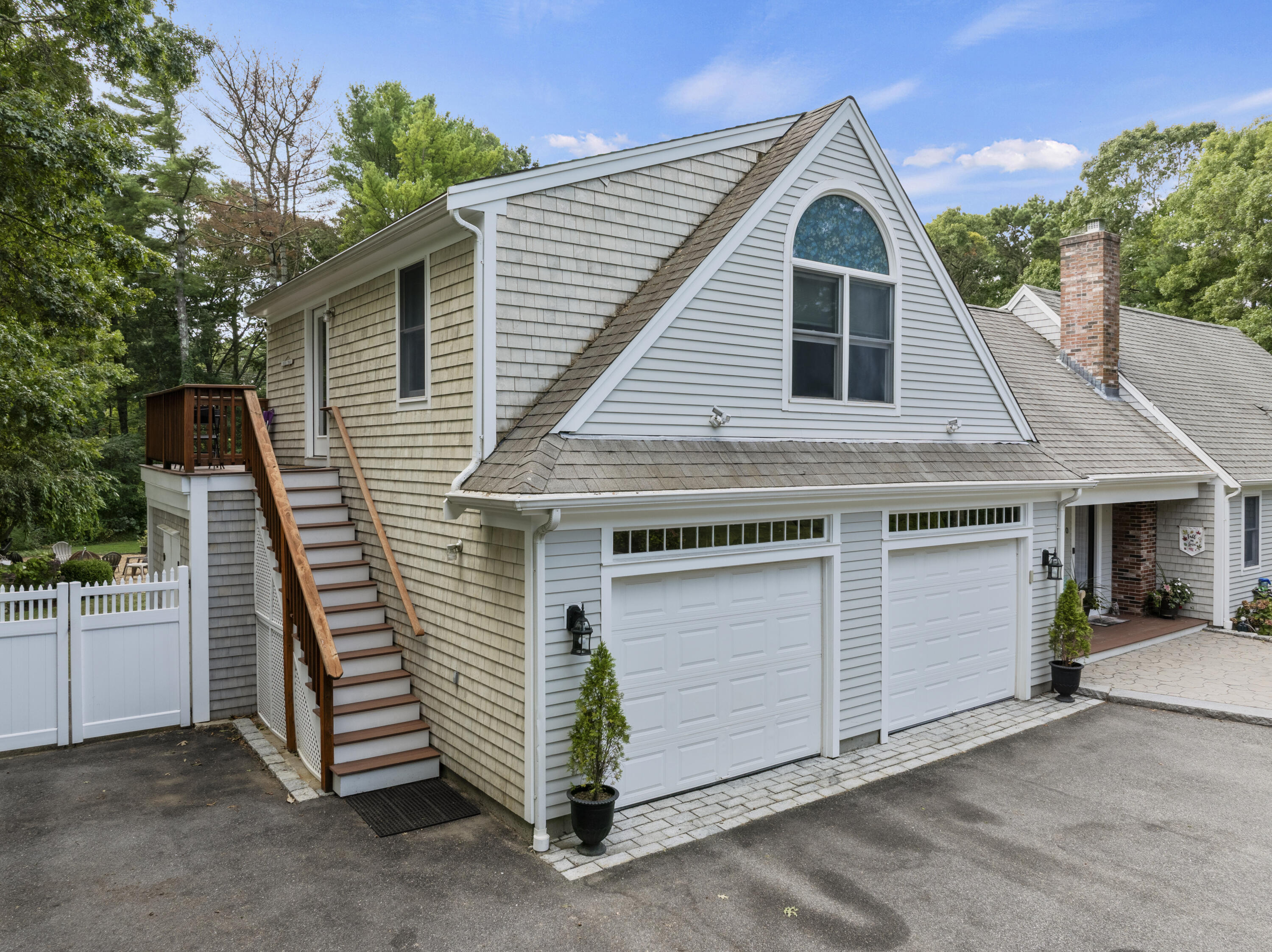 750 Old Barnstable Road Mashpee, MA 02649 - Photo 19 of 30 a view of a house with a garage