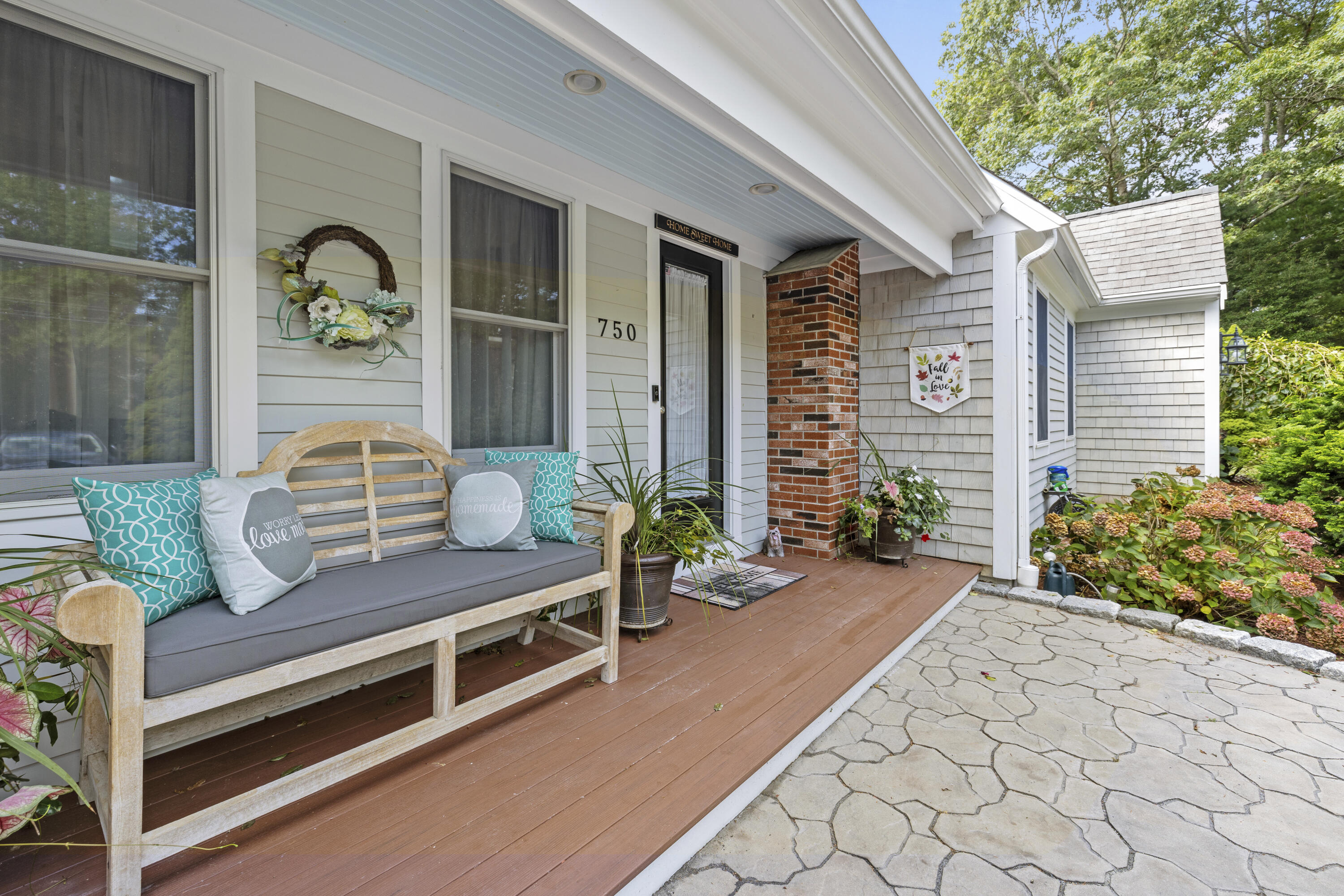 750 Old Barnstable Road Mashpee, MA 02649 - Photo 2 of 30 a roof deck with table and potted plants